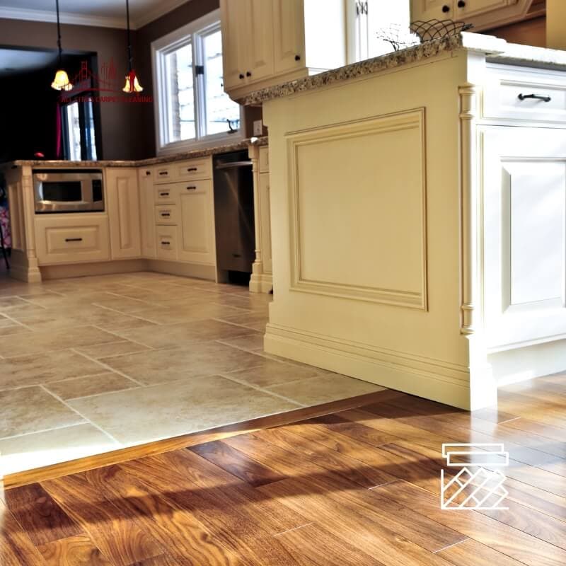 Kitchen floor with large polished tiles and bright grout lines showing results of professional tile and grout cleaning service in Bay Area