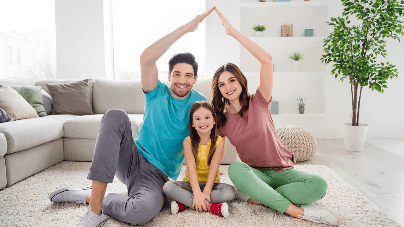 Family sitting on freshly cleaned carpet
