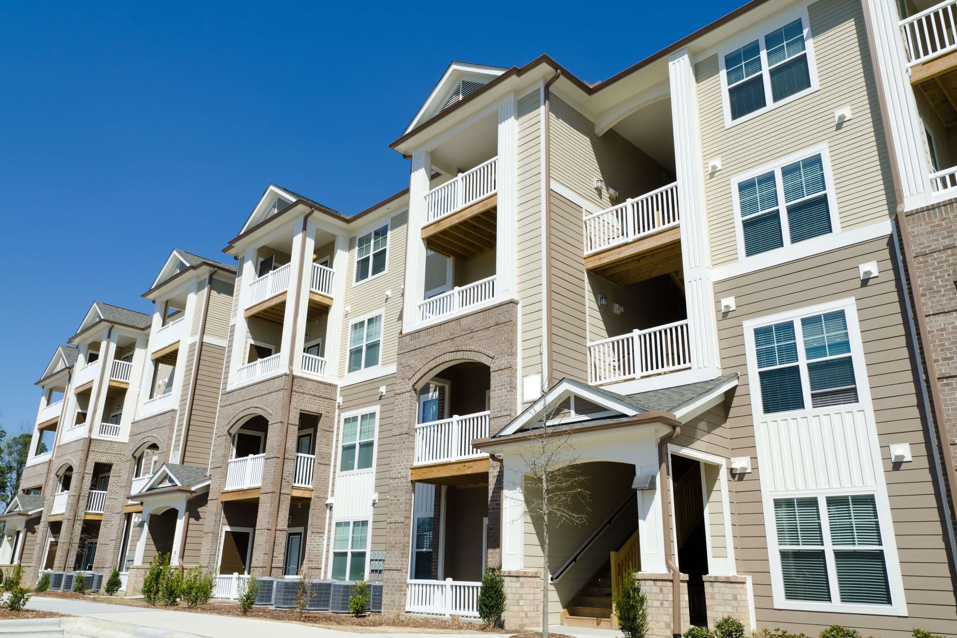 Apartment and condo building exterior representing professional property management carpet cleaning services